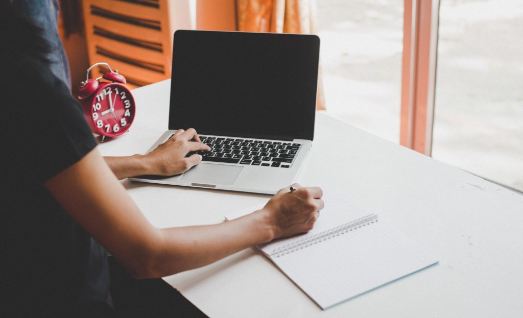 Person registering for webinar on laptop